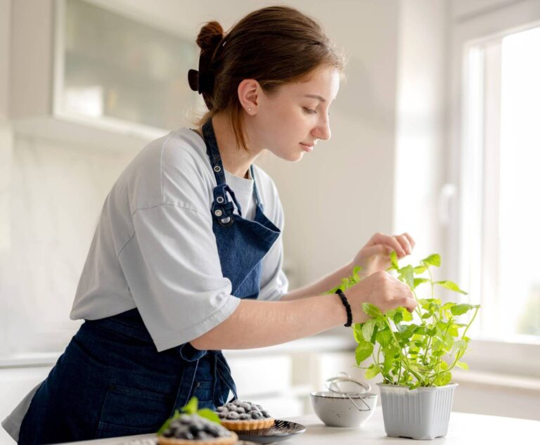 young-woman-preparing-blueberry-tart