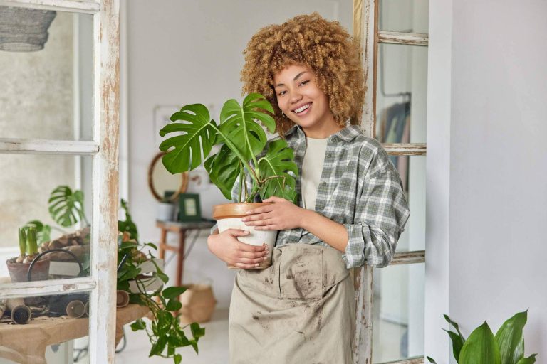 indoor-shot-of-cheerful-curly-haired-woman